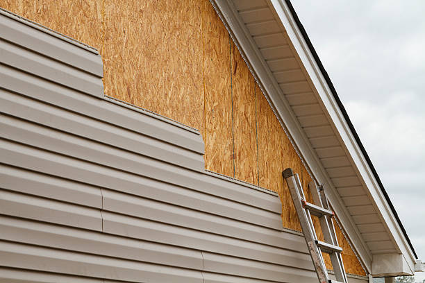 Professional Siding technician working in Charlestown, IN